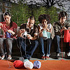 Fontbonne University > Group of people knitting on sofa in living room