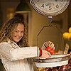 Fontbonne University > Young woman weighing tomatoes
