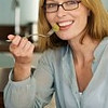 Fontbonne University > Smiling woman eating fruit salad